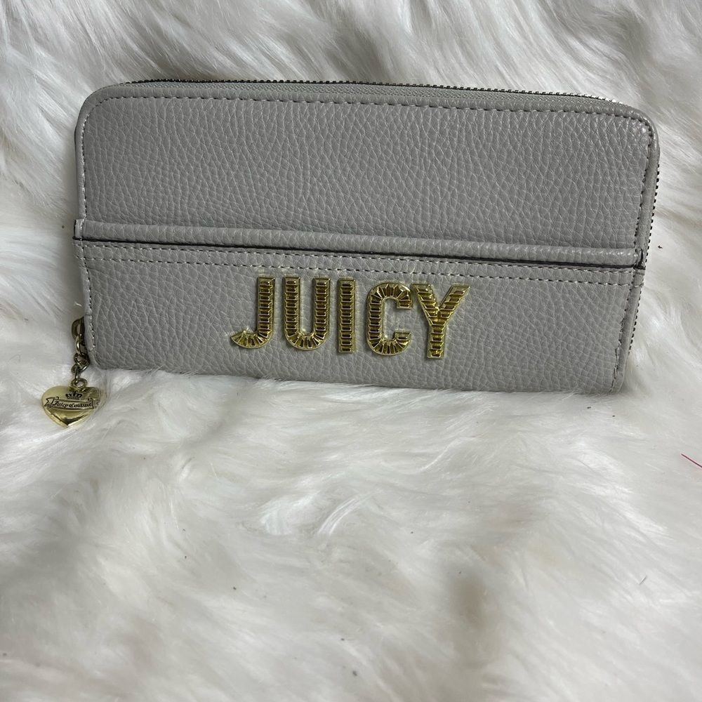 NWOT Juicy Couture gray zipper wallet with gold tone accents.